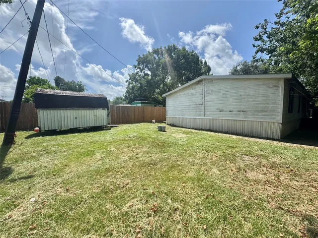 a view of a backyard of the house
