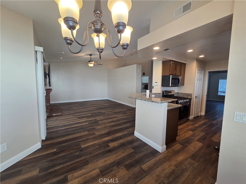 730 Black Oak Circle Corona, CA 92881 - Photo 2 of 7 a kitchen view with stainless steel appliances a stove refrigerator and cabinets