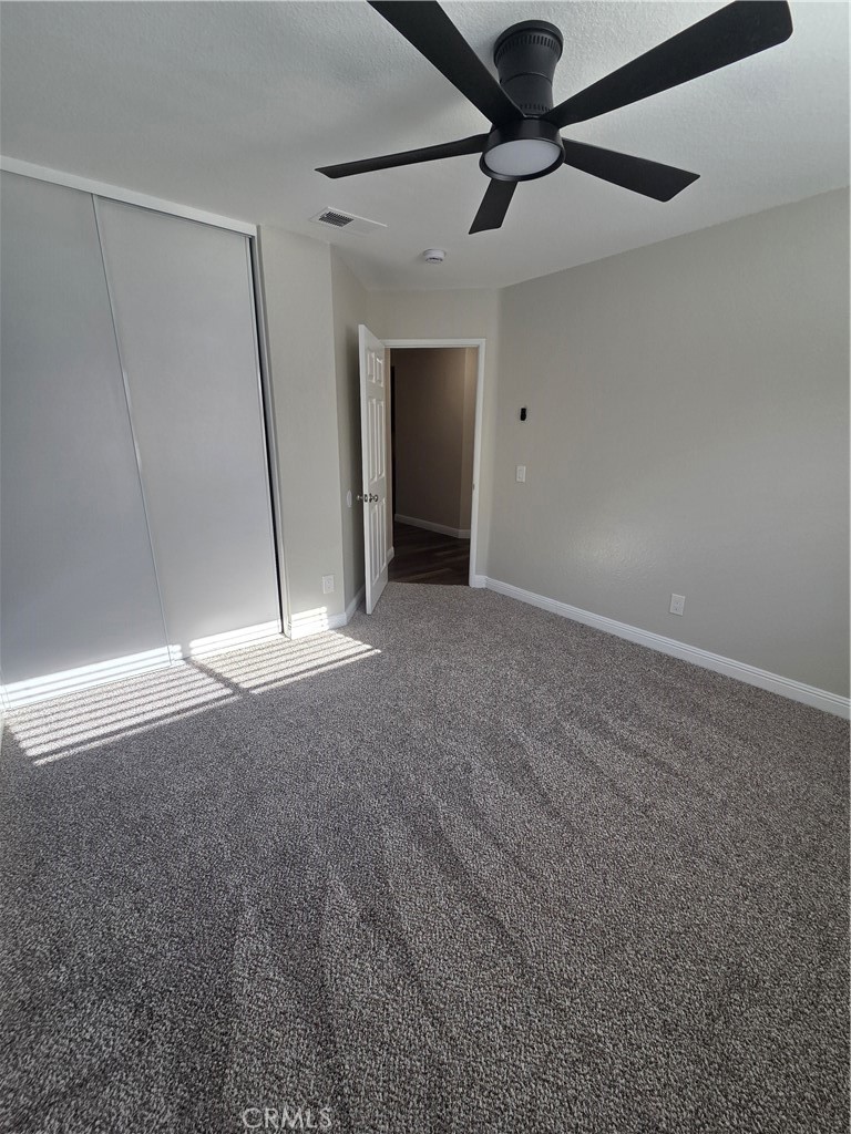 730 Black Oak Circle Corona, CA 92881 - Photo 5 of 7 a view of a livingroom with a ceiling fan and window