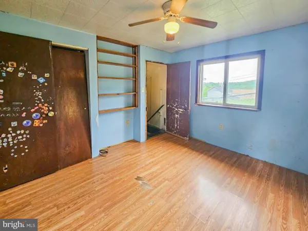 a bathroom with a tub a sink and mirror