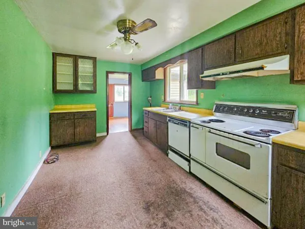 a kitchen with a stove and a microwave oven