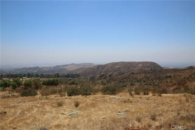 a view of a town with mountains in the background