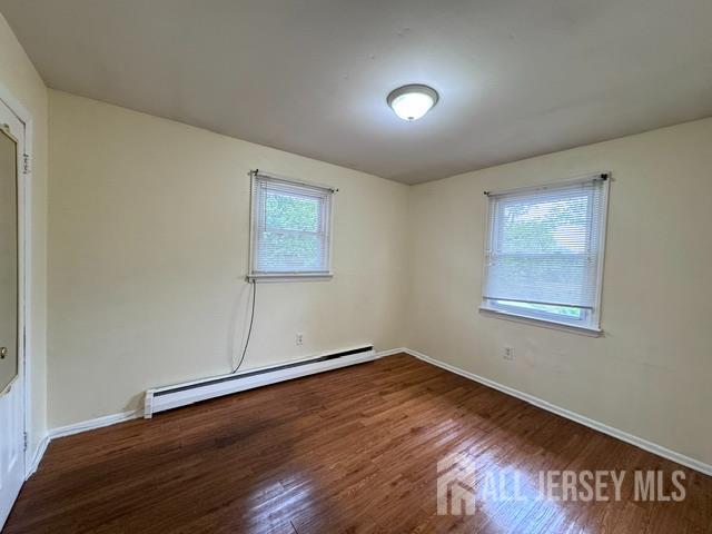 760 Mary Street, Unit B Perth Amboy, NJ 08861 - Photo 7 of 10 a view of a room with wooden floor and window