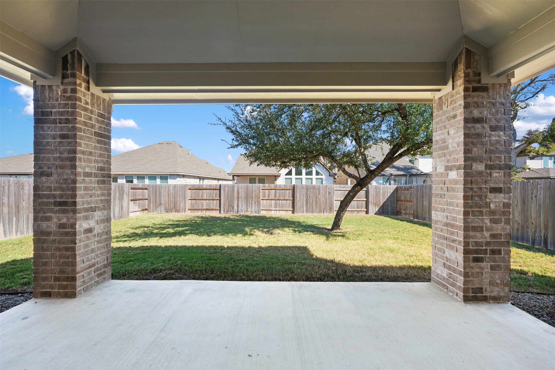 208 Golden Gate Lane Kyle, TX 78640 - Photo 28 of 40 Extended patio with plenty of room for outdoor furniture and your favorite grill