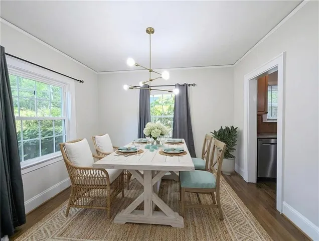 a view of a dining room with furniture window and wooden floor
