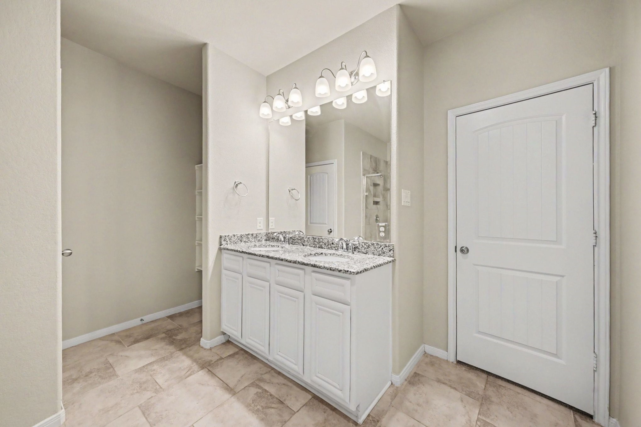 24554 Grayson Falls Lane Spring, TX 77389 - Photo 16 of 27 a bathroom with a granite countertop sink a mirror and a shower