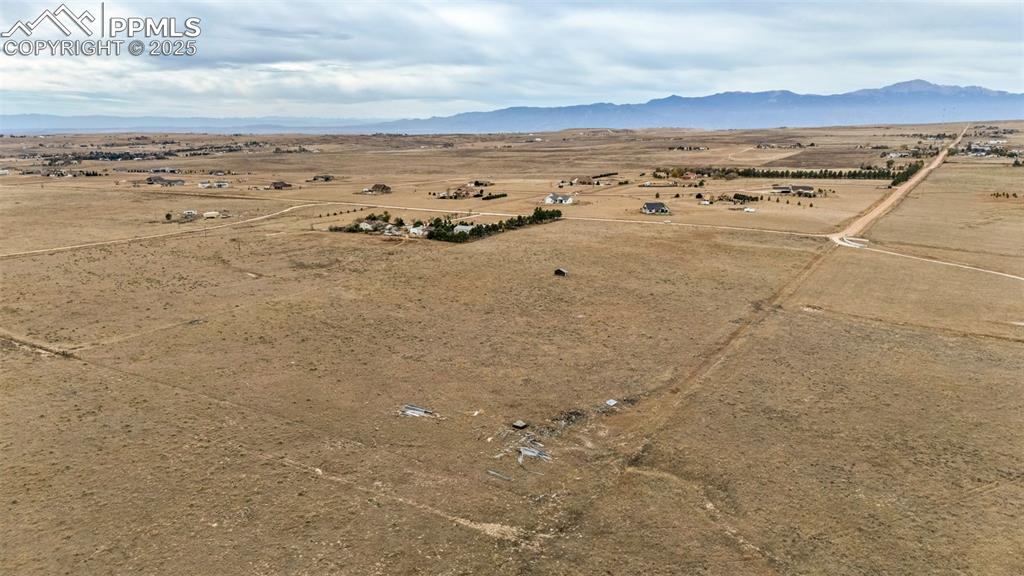 a view of an ocean beach and mountain