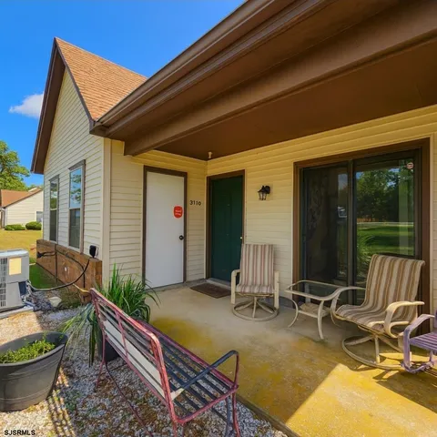 a view of house with patio outdoor seating area