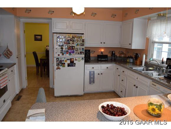 739 Cattle Scales Road Waynesboro, VA 22980 - Photo 18 of 36 a kitchen with a refrigerator and a stove top oven