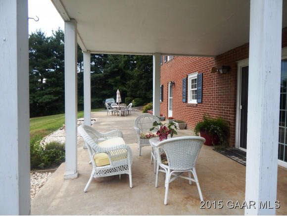739 Cattle Scales Road Waynesboro, VA 22980 - Photo 7 of 36 a view of a patio with table and chairs and potted plants