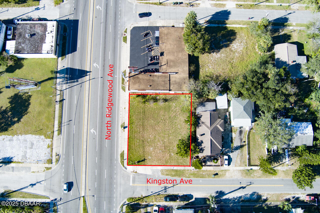 0 North Ridgewood Avenue Daytona Beach, FL 32114 - Photo 1 of 7 an aerial view of residential houses with outdoor space