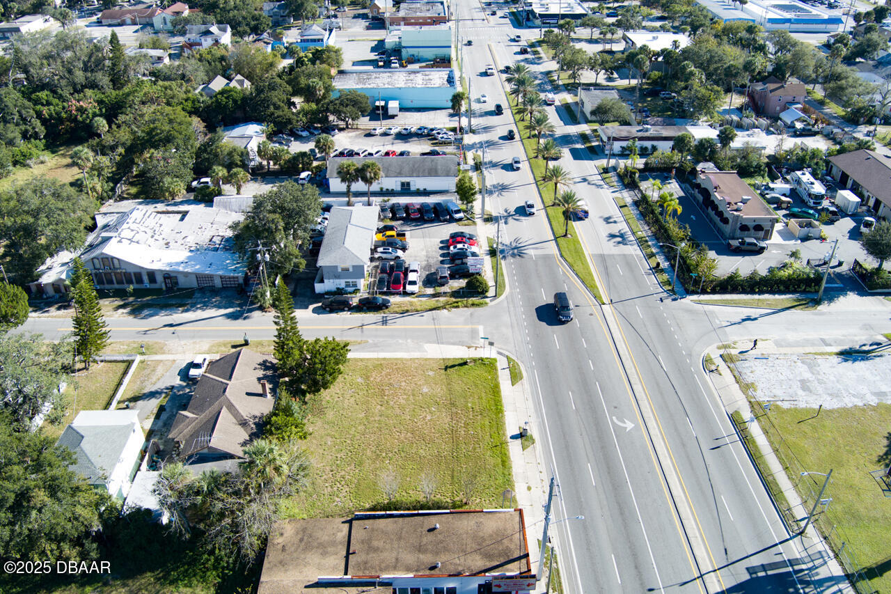 0 North Ridgewood Avenue Daytona Beach, FL 32114 - Photo 6 of 7 an aerial view of residential houses with outdoor space