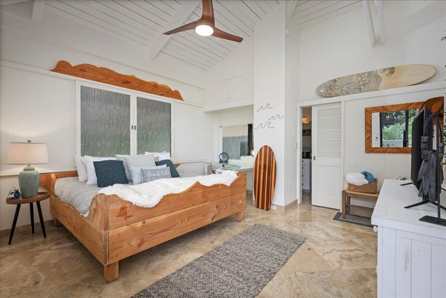 a bathroom with a granite countertop sink a mirror and shower