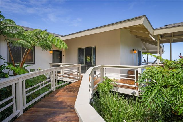 a balcony view with a seating space