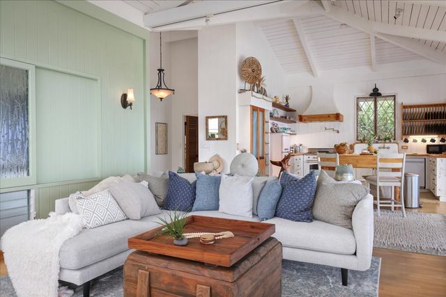 a kitchen with cabinets appliances and furniture