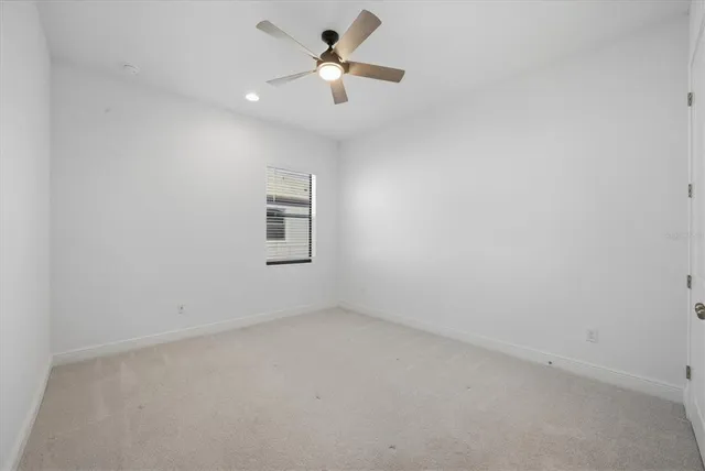 an empty room with a empty space and windows