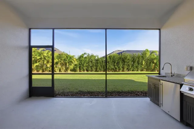 a view of a green field with clear sky