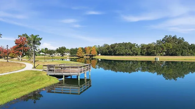 a view of a swimming pool with a table and chairs