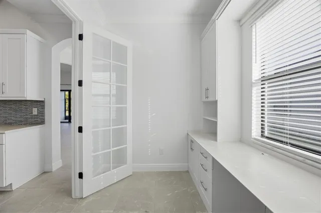 a bathroom with a double vanity sink and shower