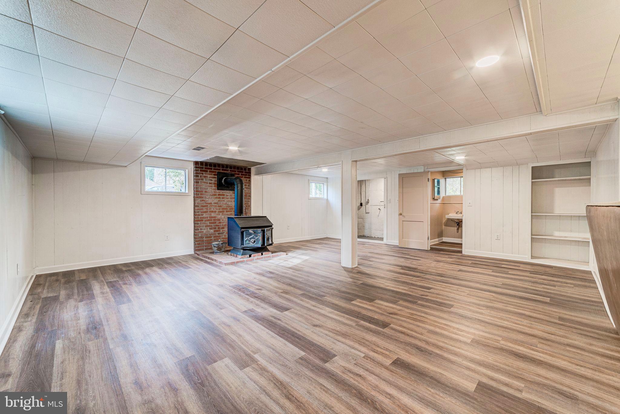 7219 Tanager Street Springfield, VA 22150 - Photo 37 of 55 Lower Level Rec Room with Wood Burning Stove