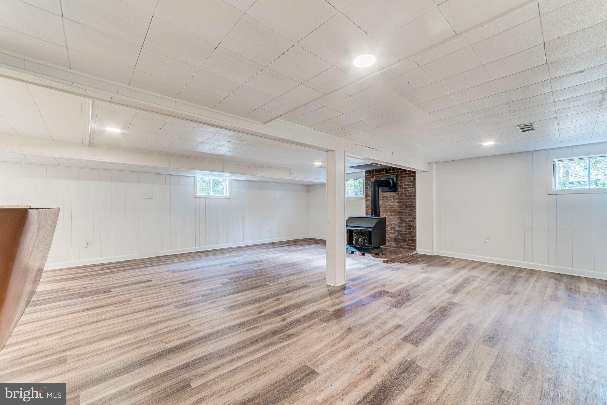 7219 Tanager Street Springfield, VA 22150 - Photo 39 of 55 Lower Level Rec Room with Wood Burning Stove