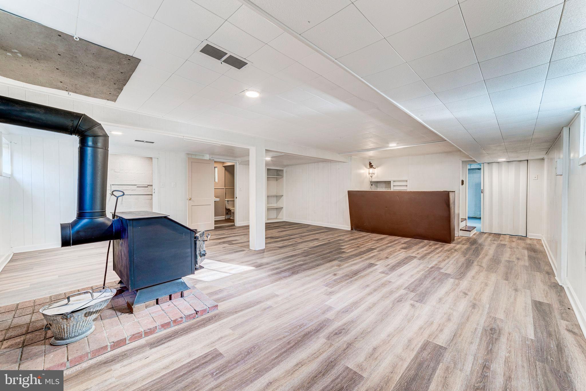 7219 Tanager Street Springfield, VA 22150 - Photo 41 of 55 Lower Level Rec Room with Wood Burning Stove