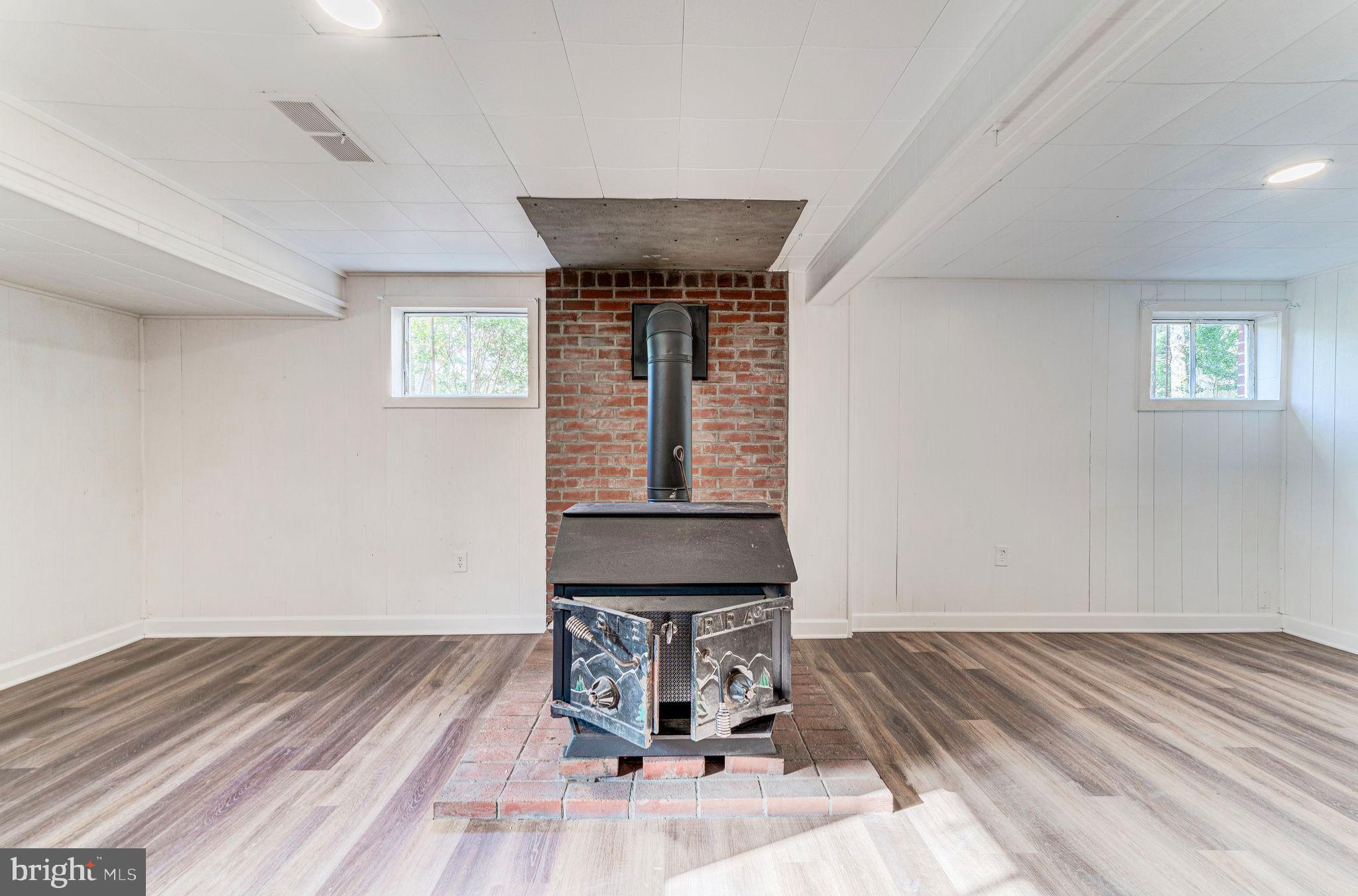 7219 Tanager Street Springfield, VA 22150 - Photo 42 of 55 Lower Level Rec Room with Wood Burning Stove