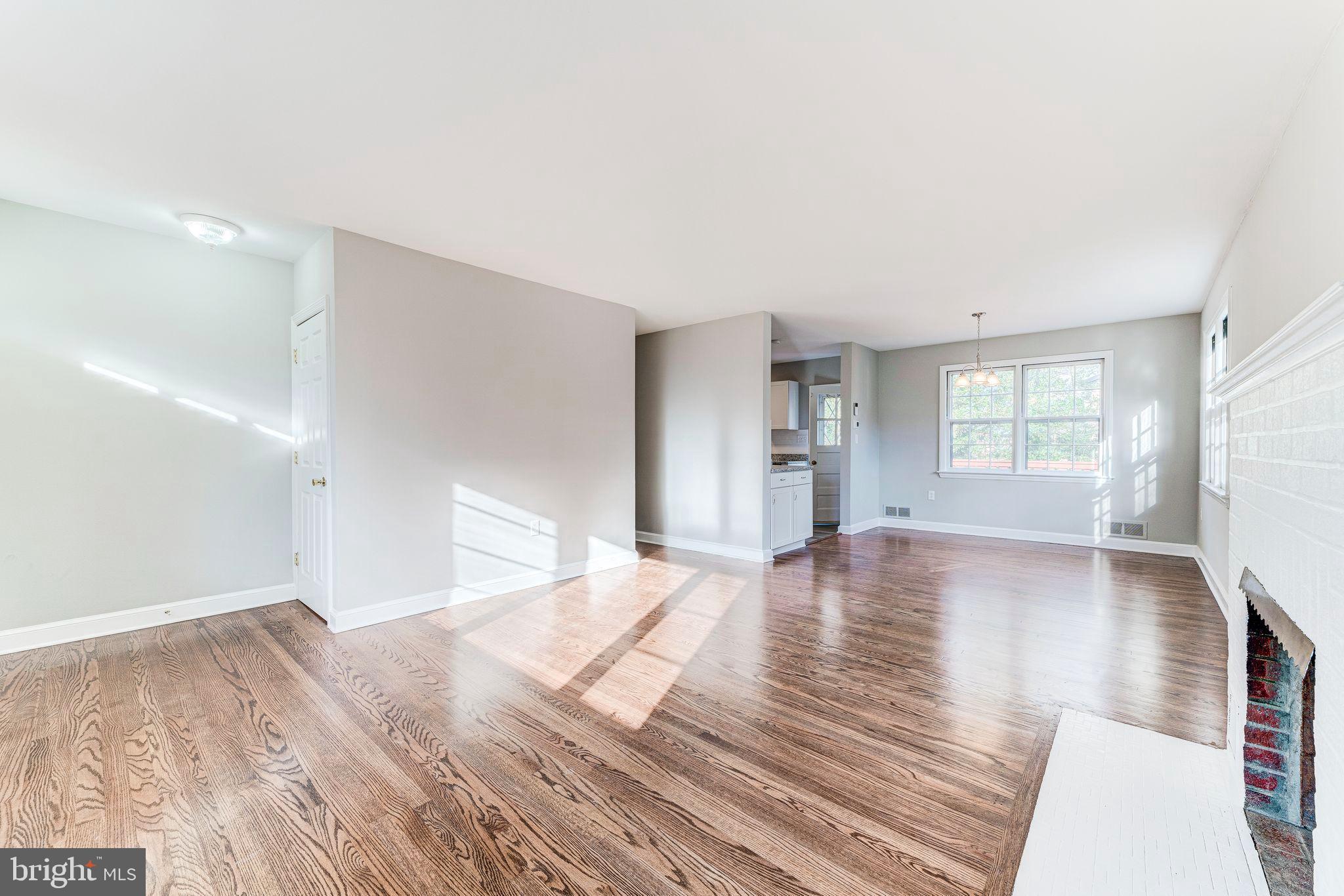 7219 Tanager Street Springfield, VA 22150 - Photo 8 of 55 Living Room looking onto dining room