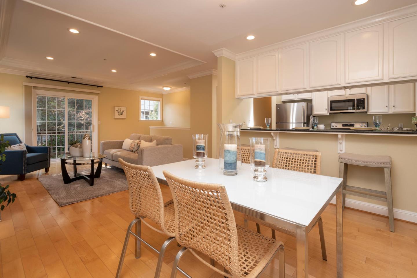 914 Palm Avenue San Mateo, CA 94401 - Photo 21 of 24 a living room with stainless steel appliances a dining table and chairs