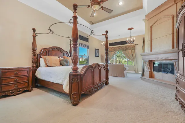 a bedroom with a bed and a fireplace