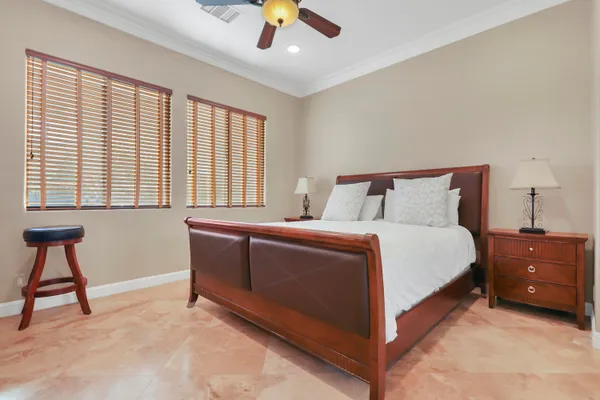 a bedroom with a bed and a chair