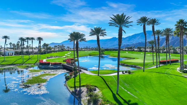 a view of a park with iron fence