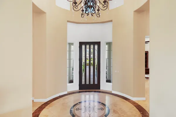 a view of a hallway with a chandelier