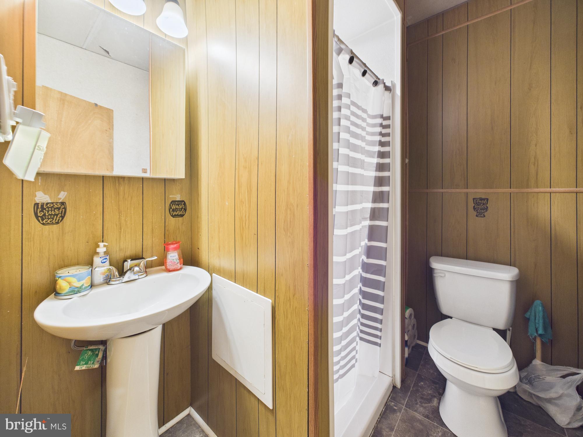 828 West Princess Street York, PA 17401 - Photo 13 of 32 a bathroom with a sink a toilet and shower