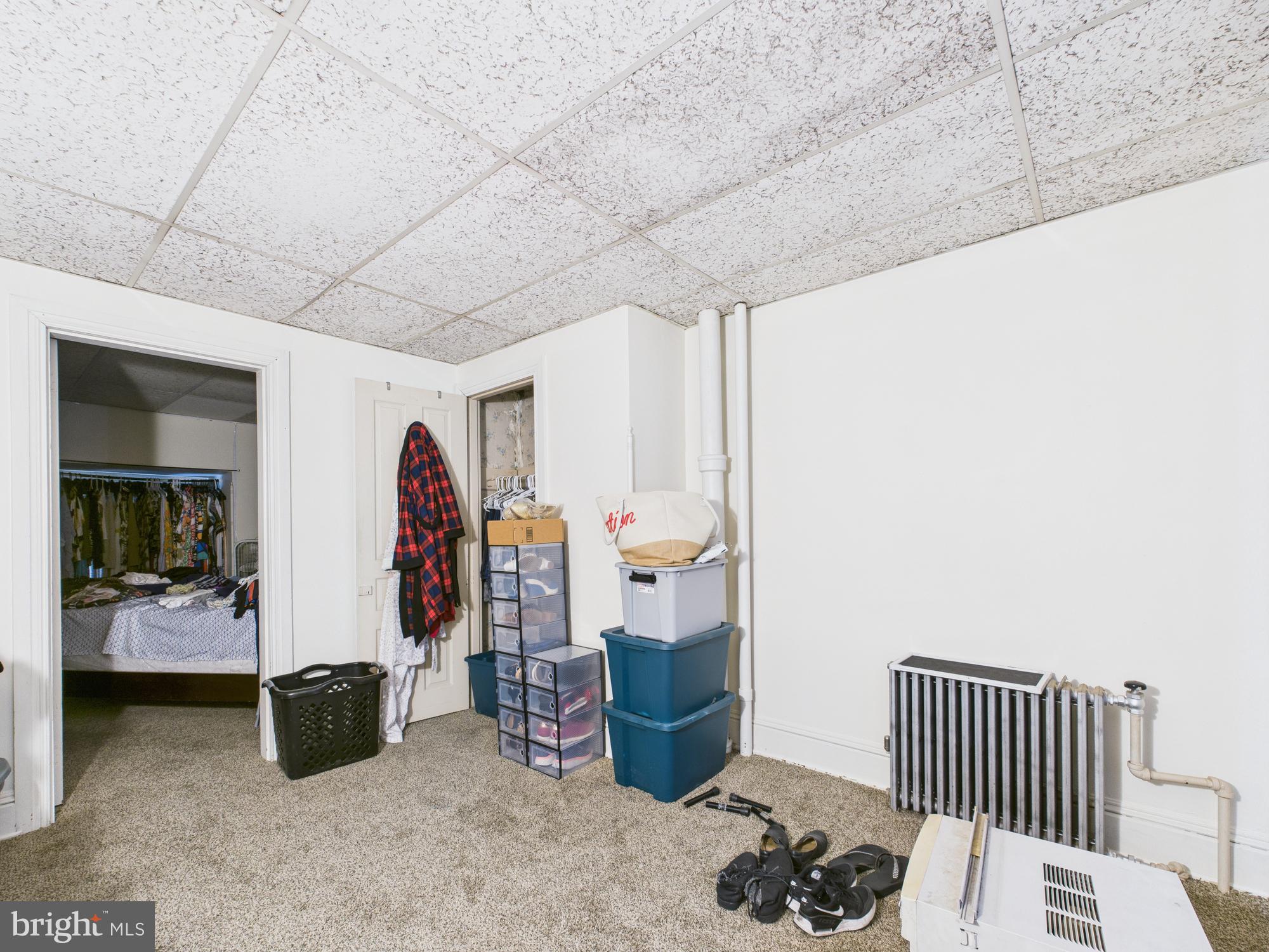 828 West Princess Street York, PA 17401 - Photo 25 of 32 a bedroom with furniture and a book shelf