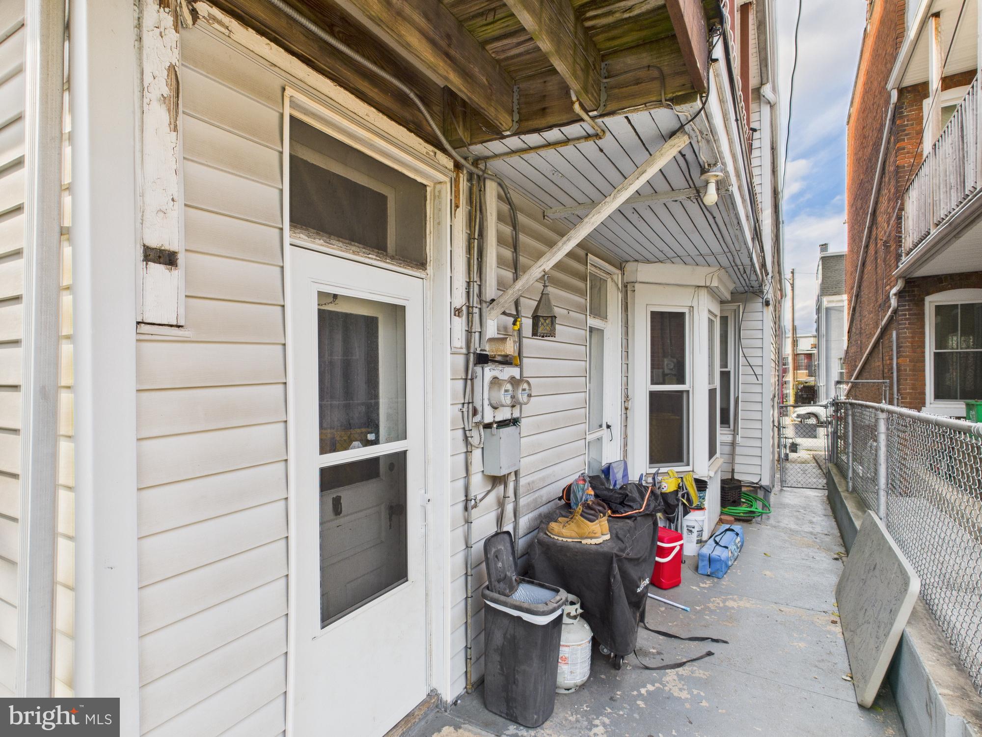 828 West Princess Street York, PA 17401 - Photo 4 of 32 a view of a patio with table and chairs and potted plants