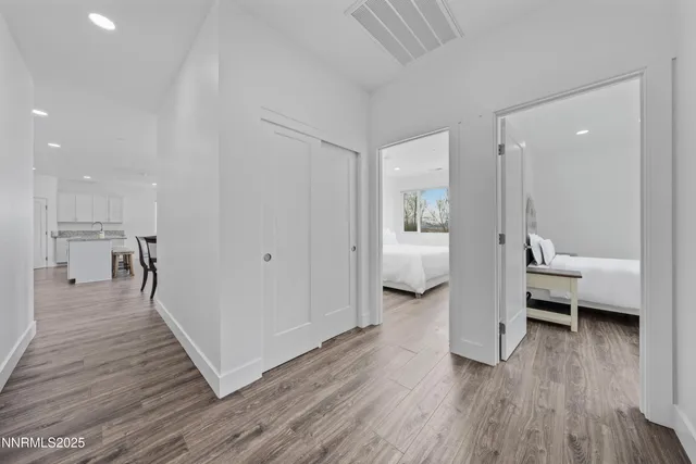 a kitchen with stainless steel appliances granite countertop wooden cabinets a stove top oven a sink and dishwasher