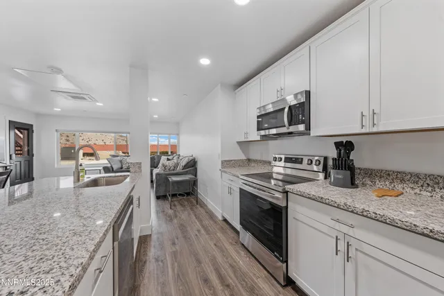 a bedroom with a bed and a large mirror