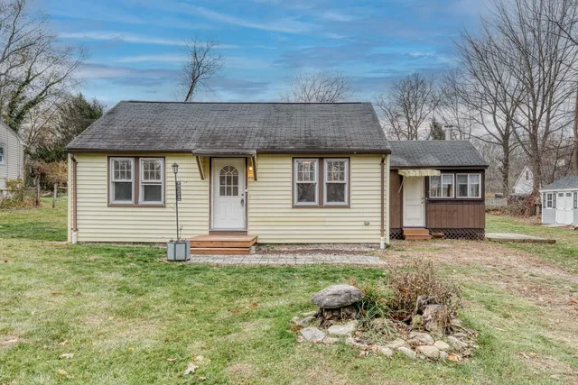 a house view with a backyard space