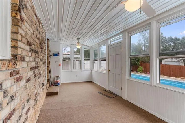 a view of empty room with windows