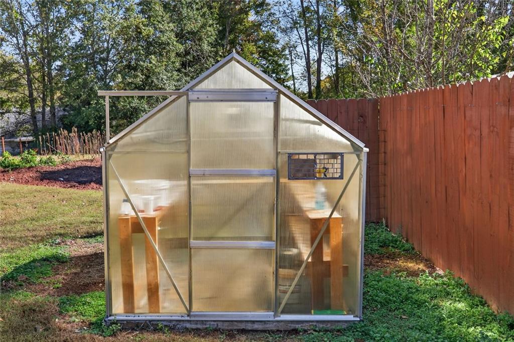 7306 Mt Vernon Road Lithia Springs, GA 30122 - Photo 33 of 48 a house view with a garden space
