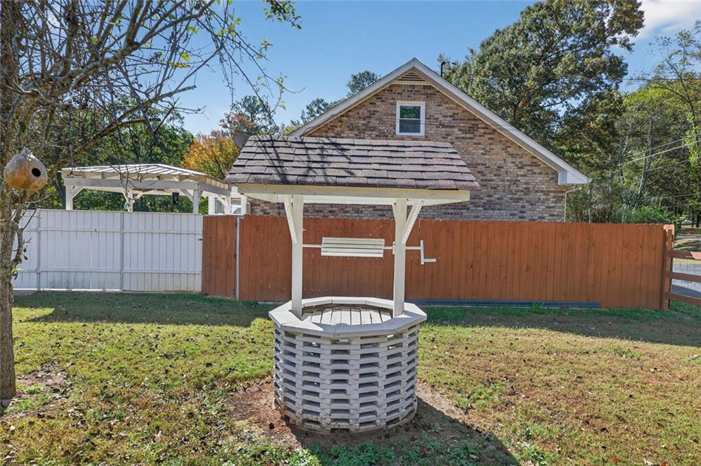 7306 Mt Vernon Road Lithia Springs, GA 30122 - Photo 35 of 48 a front view of a house with a yard