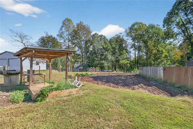 a view of backyard with green space