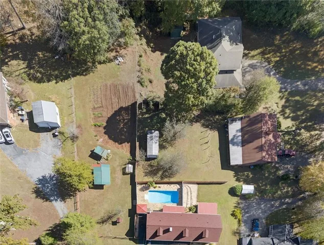 an aerial view of houses with outdoor space