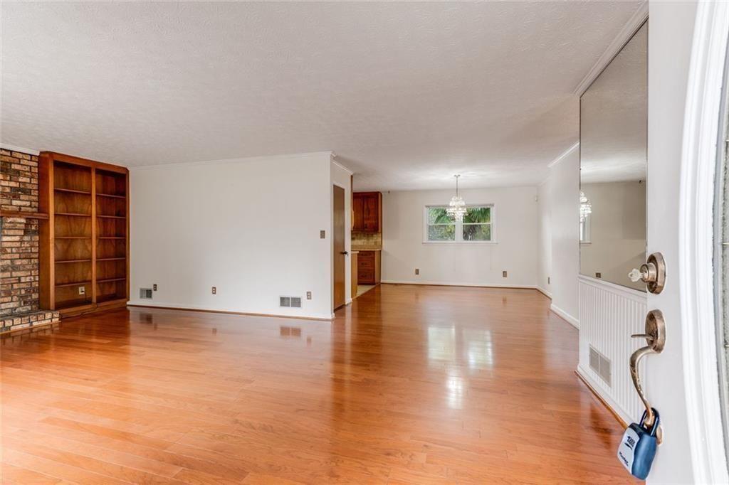 7306 Mt Vernon Road Lithia Springs, GA 30122 - Photo 5 of 48 a view of a livingroom with wooden floor and a large window