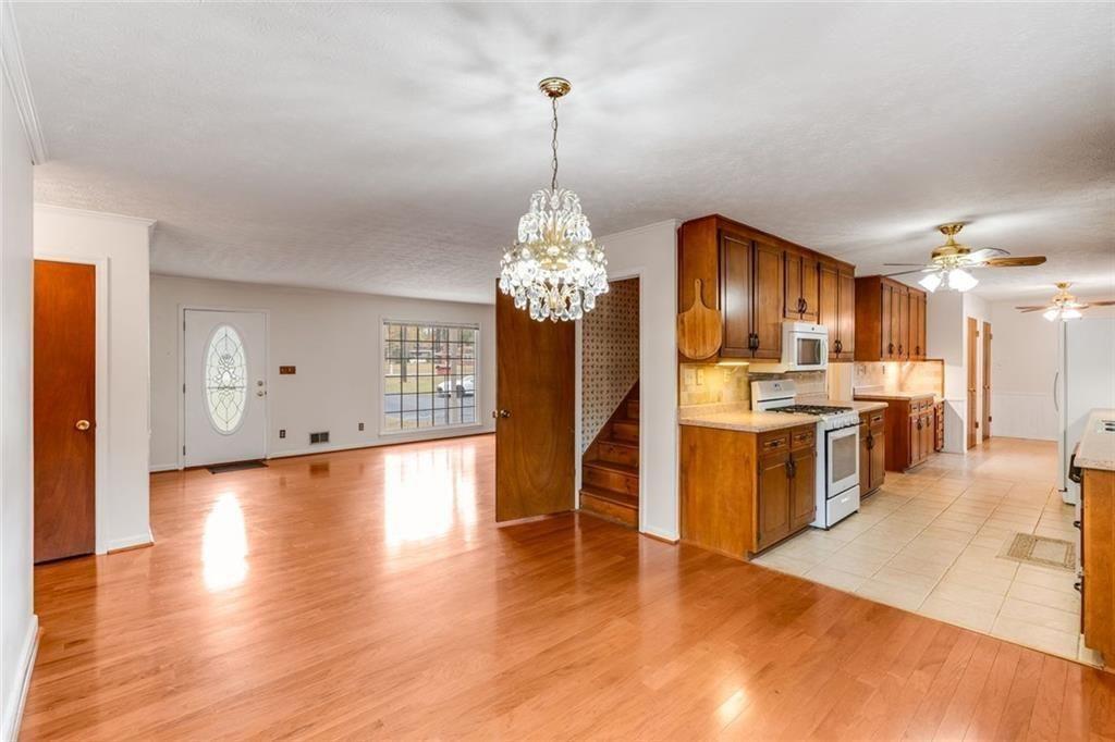 7306 Mt Vernon Road Lithia Springs, GA 30122 - Photo 9 of 48 a view of a kitchen with cabinets and stainless steel appliances
