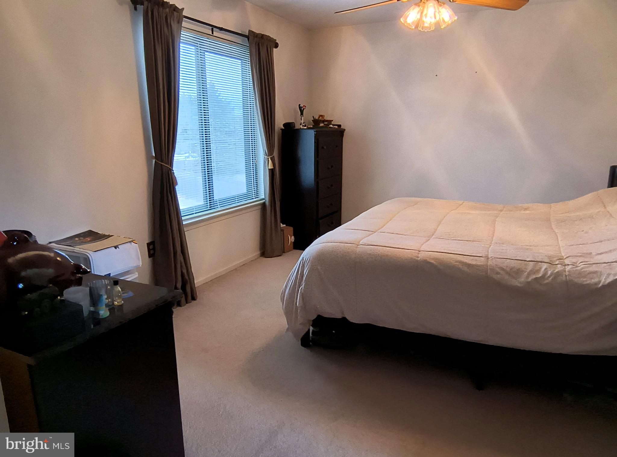 102 Providence Drive Bear, DE 19701 - Photo 11 of 21 a bedroom with a bed and a mirror