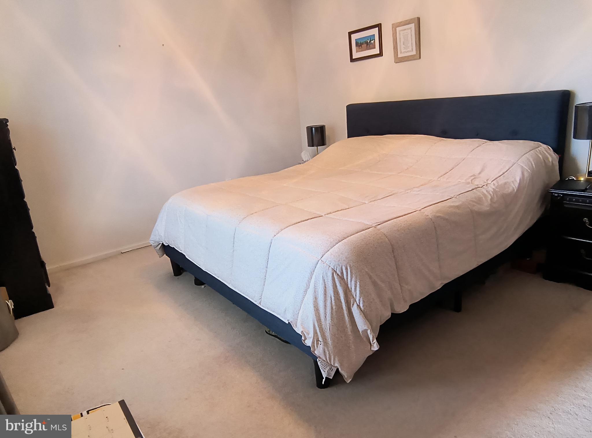 102 Providence Drive Bear, DE 19701 - Photo 12 of 21 a bedroom with a bed and a dresser