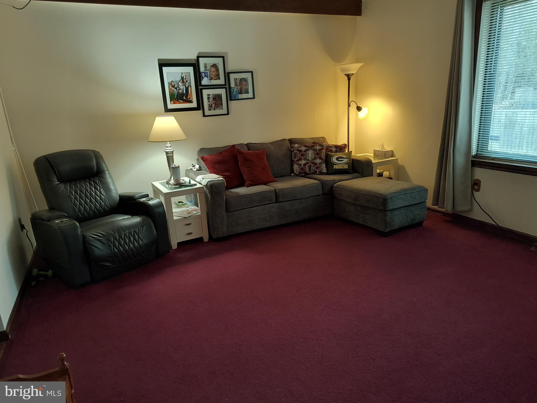 102 Providence Drive Bear, DE 19701 - Photo 7 of 21 a living room with furniture and a lamp