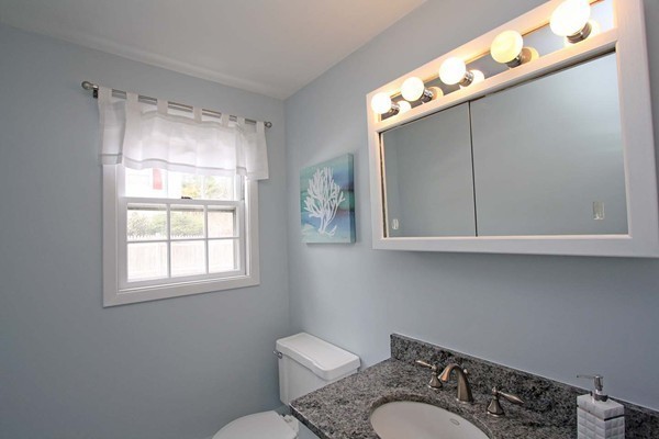 2 Santa Fe Road Chelmsford, MA 01824 - Photo 17 of 25 a bathroom with a toilet a sink and mirror